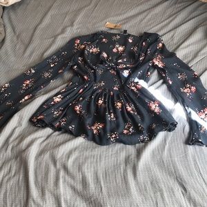 A floral long sleeve shirt with open